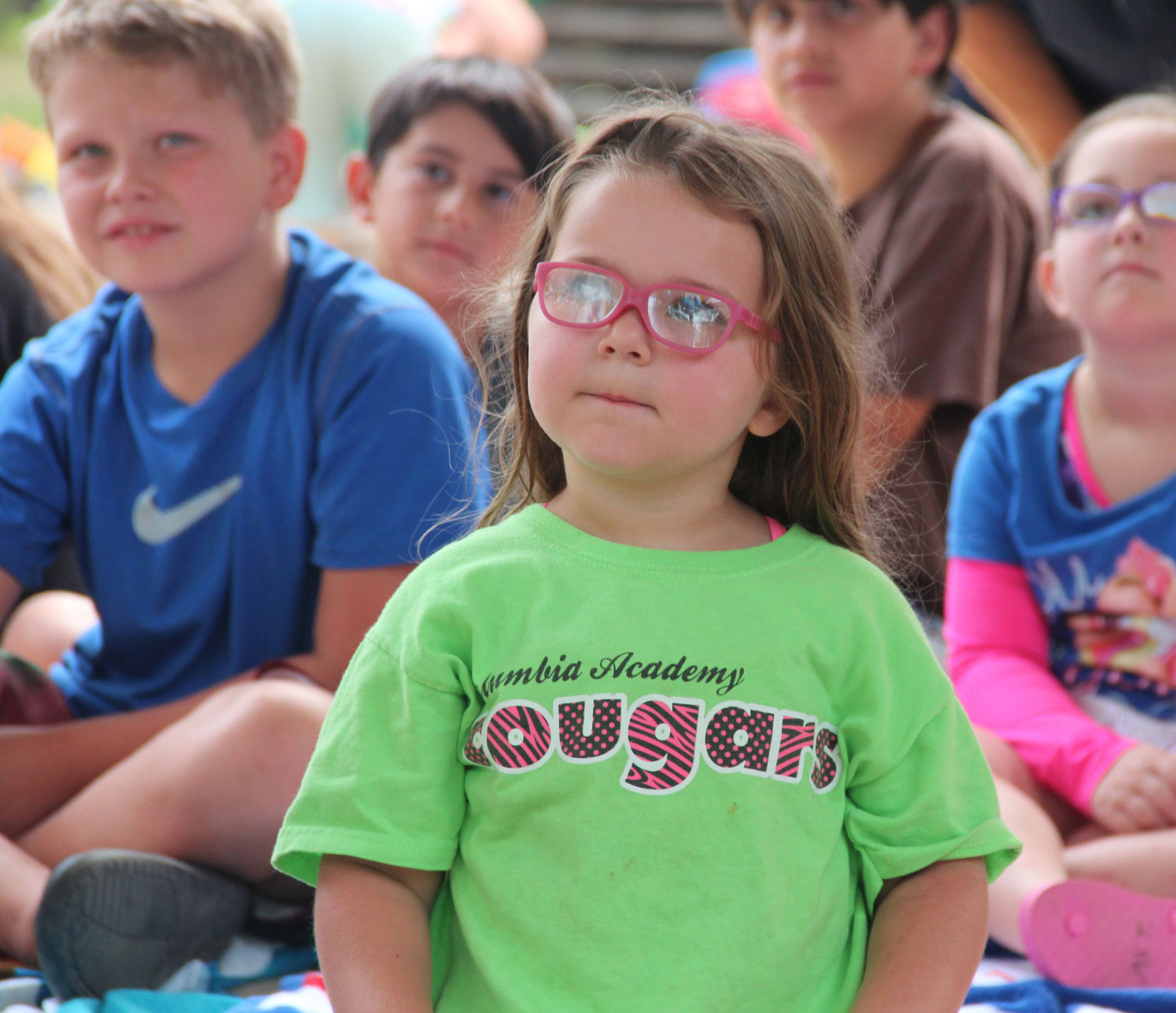 grade school kids listening to a presentation from a Pearl River Valley representative